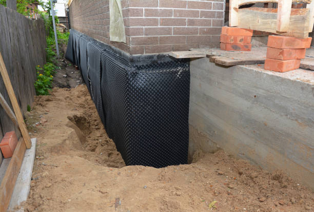 Happy homeowners after waterproofing job in Belle Plaine